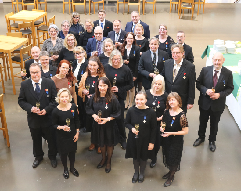 Kunniamerkin saaneet Elyläiset.